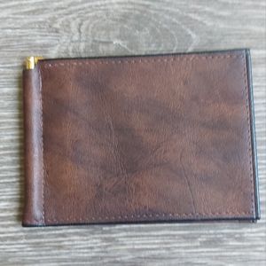 Rolfs slim cowhide wallet money clip. Very sleek and modern. NEW